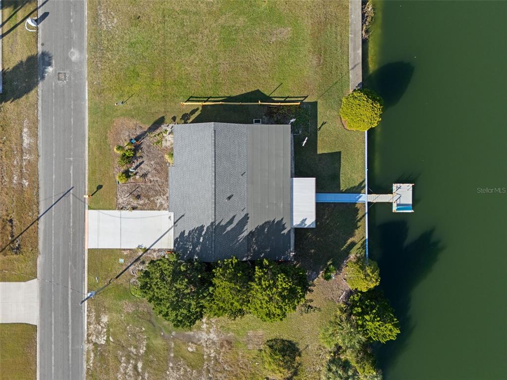 3320 Gardenia Drive Hernando Beach, FL 34607 - Photo 51 of 59 an aerial view of a house with a yard