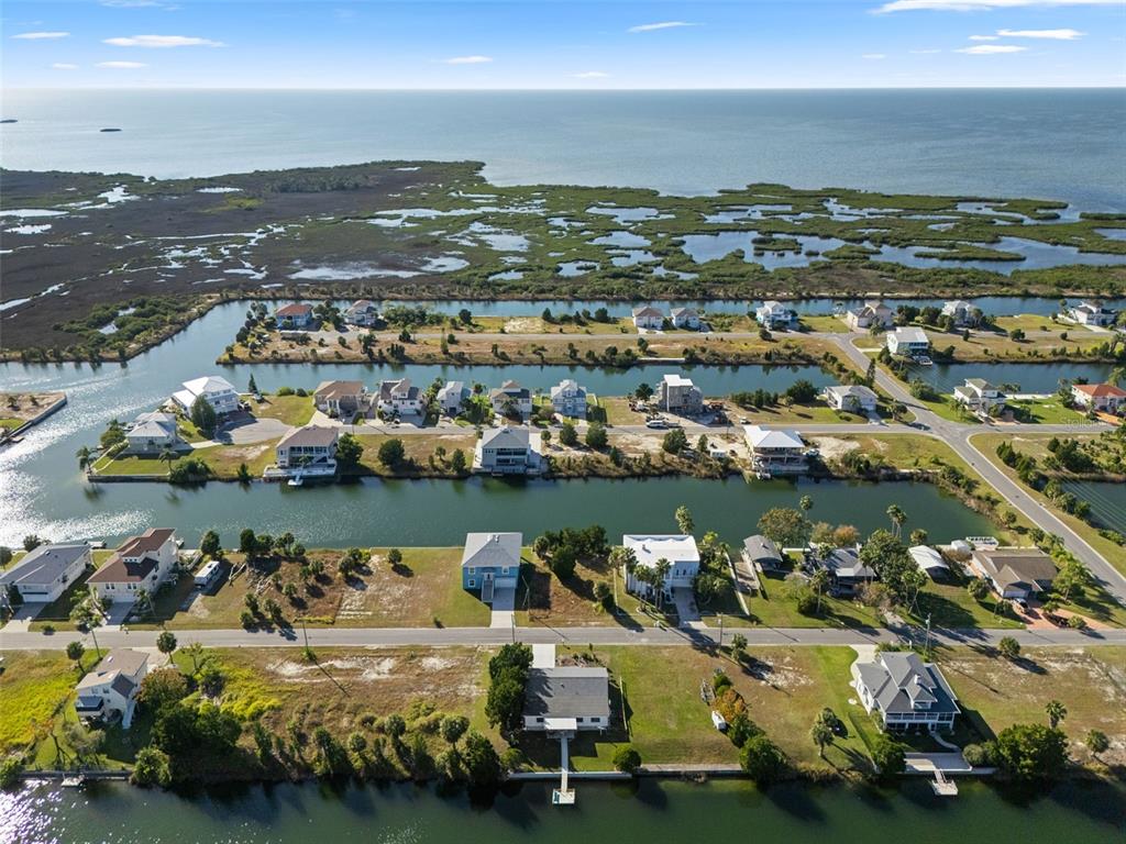 3320 Gardenia Drive Hernando Beach, FL 34607 - Photo 54 of 59 an aerial view of a city with houses