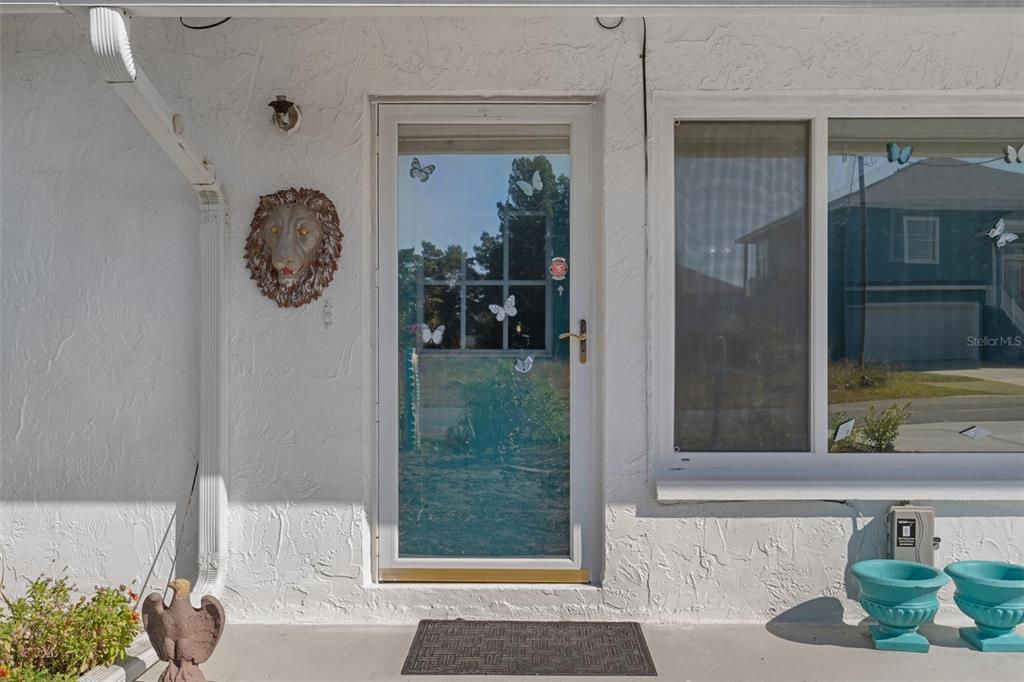 3320 Gardenia Drive Hernando Beach, FL 34607 - Photo 10 of 59 a view of a door and chair in a living room