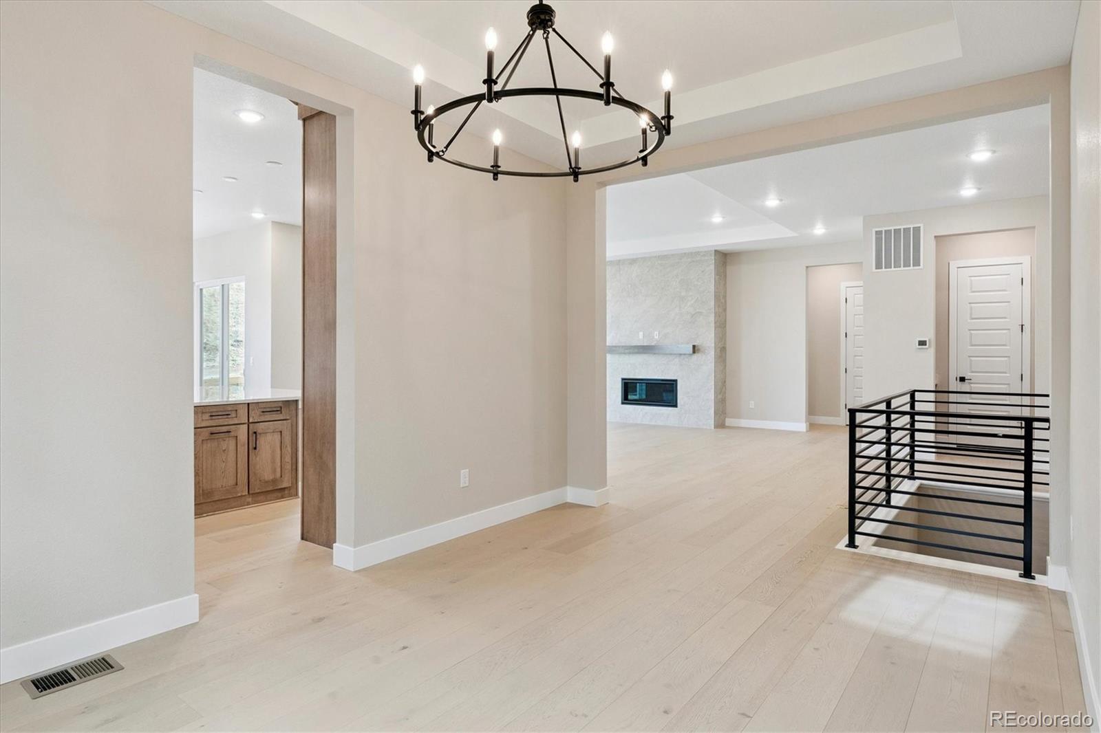 1288 Oleander Street Castle Rock, CO 80109 - Photo 12 of 29 a view of a hallway with a chandelier