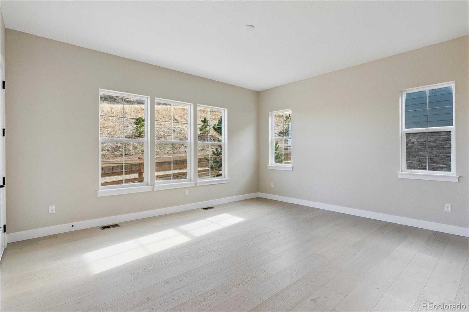 1288 Oleander Street Castle Rock, CO 80109 - Photo 15 of 29 a view of an empty room with a window