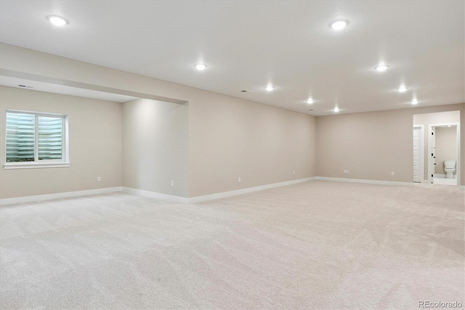 1288 Oleander Street Castle Rock, CO 80109 - Photo 18 of 29 a view of an empty room with a window