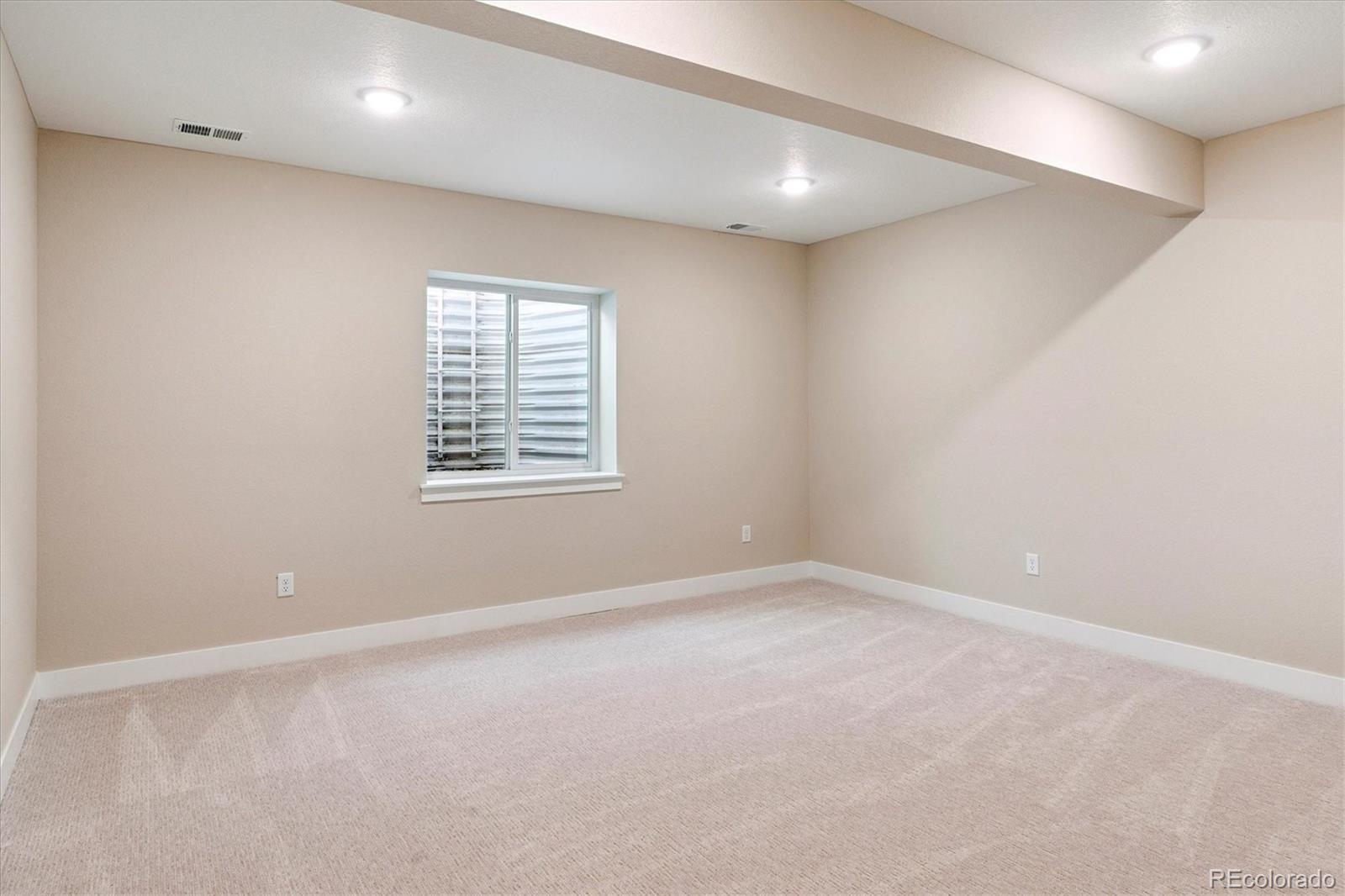 1288 Oleander Street Castle Rock, CO 80109 - Photo 23 of 29 an empty room with windows