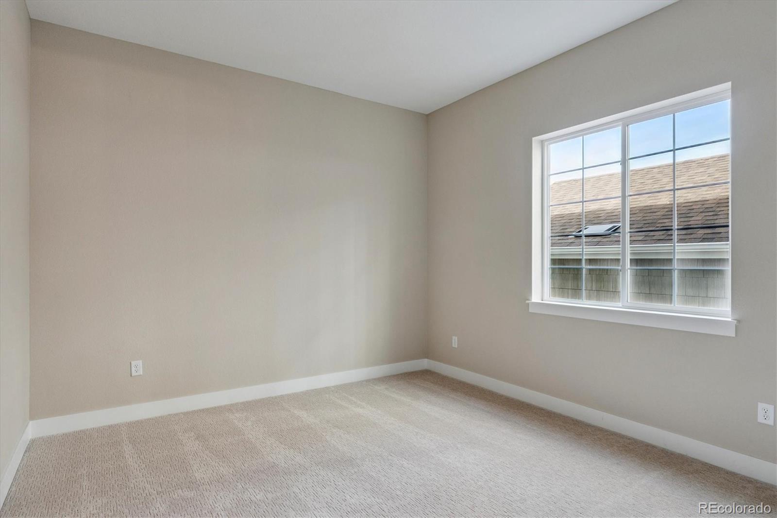1288 Oleander Street Castle Rock, CO 80109 - Photo 10 of 29 an empty room with a window