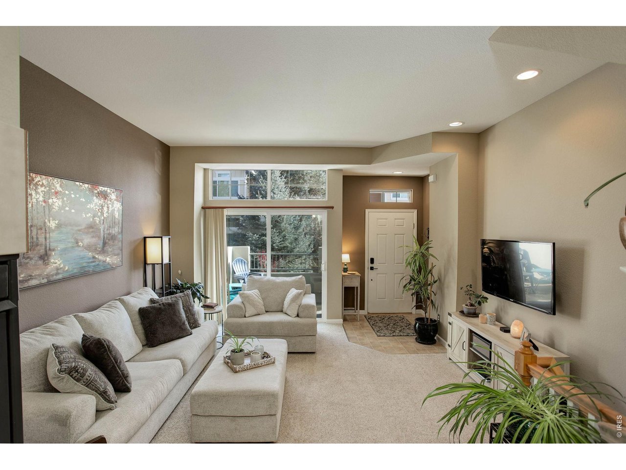 4116 Riley Drive Longmont, CO 80503 - Photo 4 of 33 Living Room has a sliding glass door for easy access to the outside patio.
