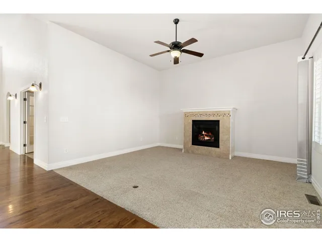 a view of empty room with fireplace