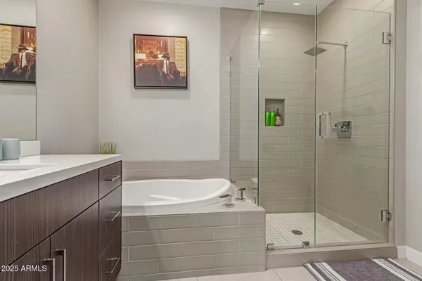 a bathroom with a bathtub and a shower