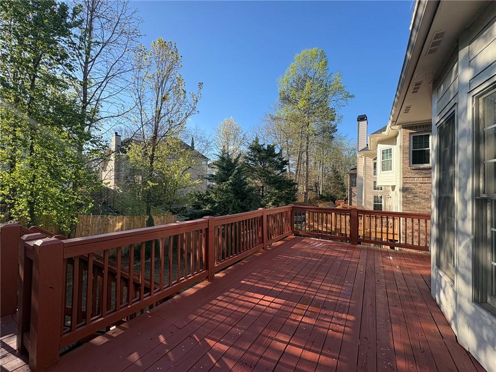 5930 Abbotts Run Trail Duluth, GA 30097 - Photo 11 of 32 a view of a porch with wooden floor and fence