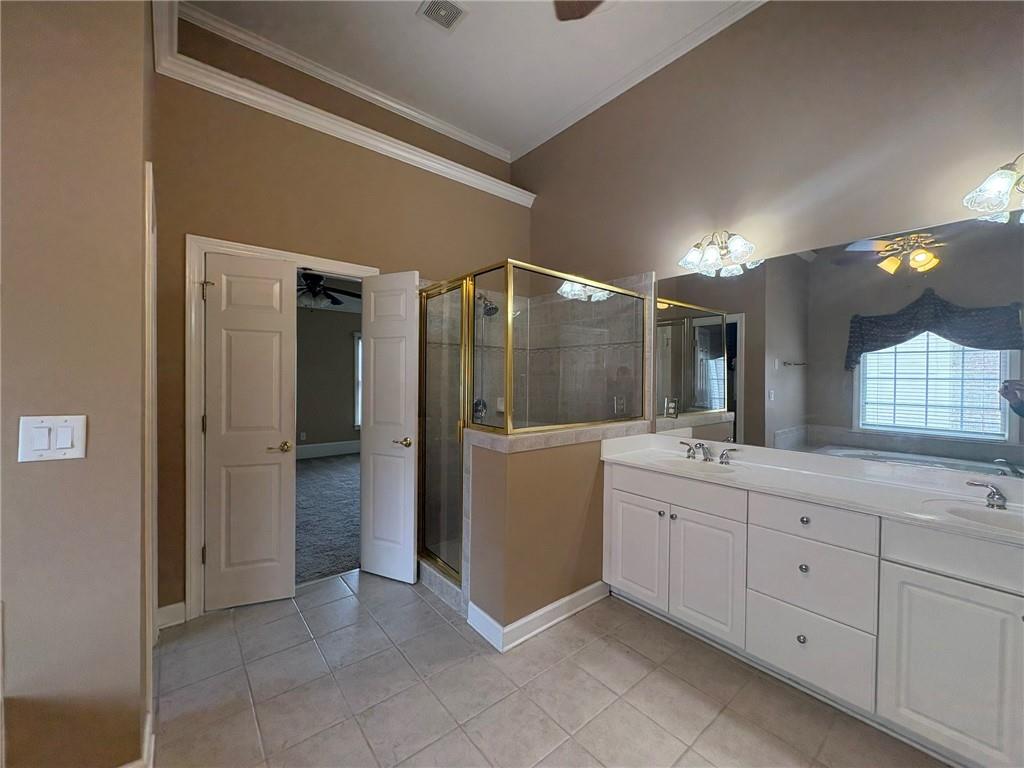 5930 Abbotts Run Trail Duluth, GA 30097 - Photo 15 of 32 a bathroom with a double vanity sink mirror and bathtub
