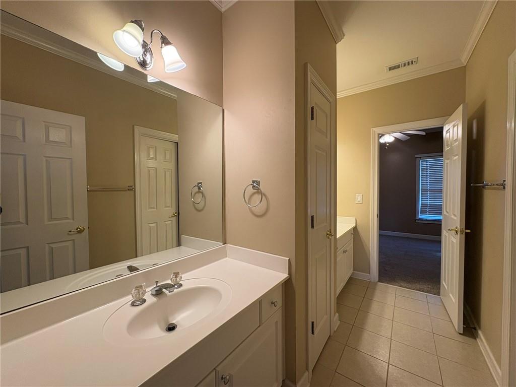 5930 Abbotts Run Trail Duluth, GA 30097 - Photo 18 of 32 a spacious bathroom with a double vanity sink and a mirror
