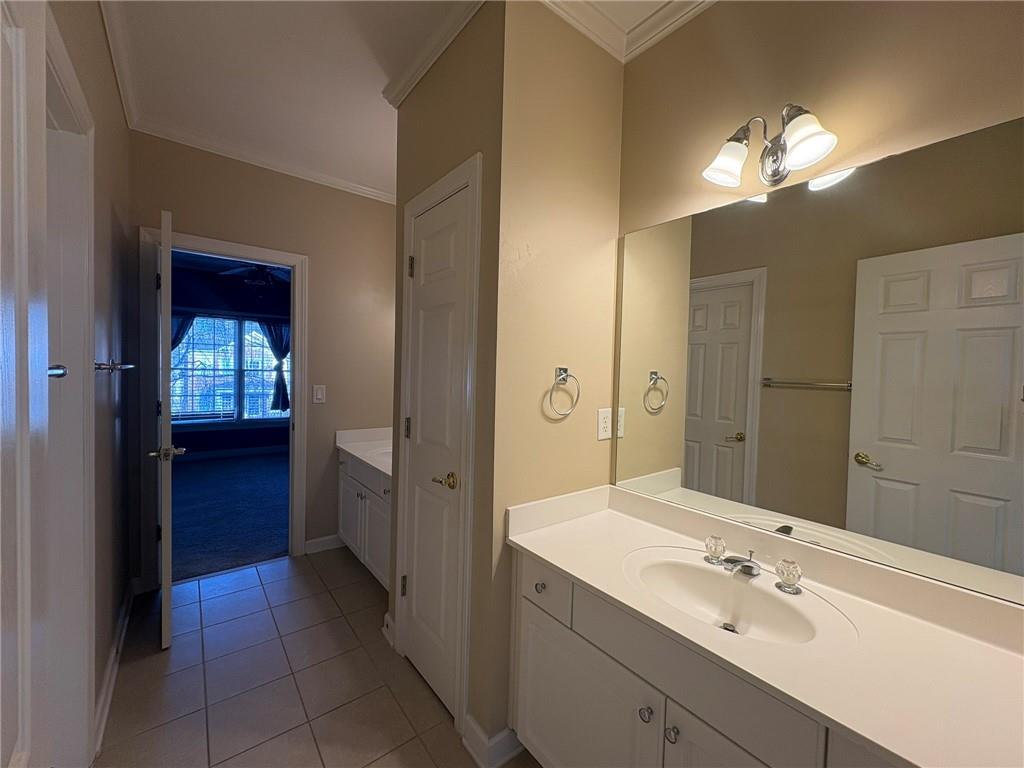 5930 Abbotts Run Trail Duluth, GA 30097 - Photo 20 of 32 a en suite bathroom with a sink and a mirror