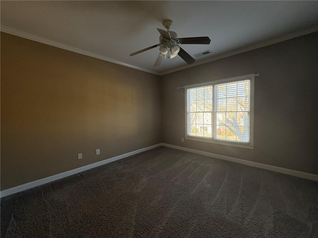 5930 Abbotts Run Trail Duluth, GA 30097 - Photo 23 of 32 an empty room with a window and a fan