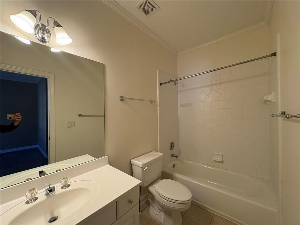 5930 Abbotts Run Trail Duluth, GA 30097 - Photo 25 of 32 a bathroom with a sink a toilet and shower