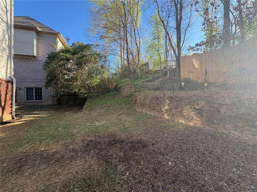5930 Abbotts Run Trail Duluth, GA 30097 - Photo 32 of 32 a view of a house with a tree
