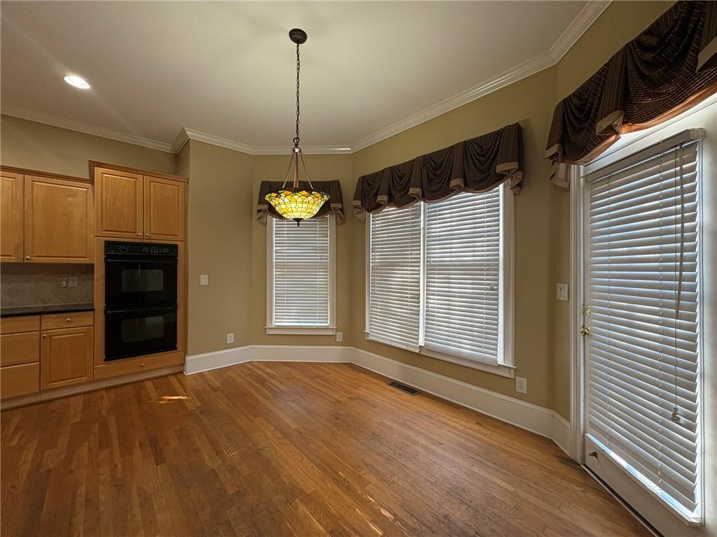 5930 Abbotts Run Trail Duluth, GA 30097 - Photo 6 of 32 a view of an empty room with a kitchen and a window