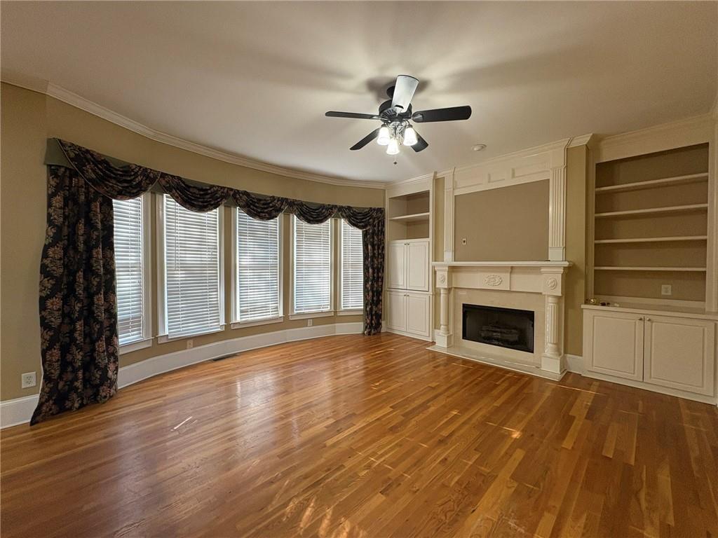 5930 Abbotts Run Trail Duluth, GA 30097 - Photo 7 of 32 a view of an empty room with a fireplace and a window