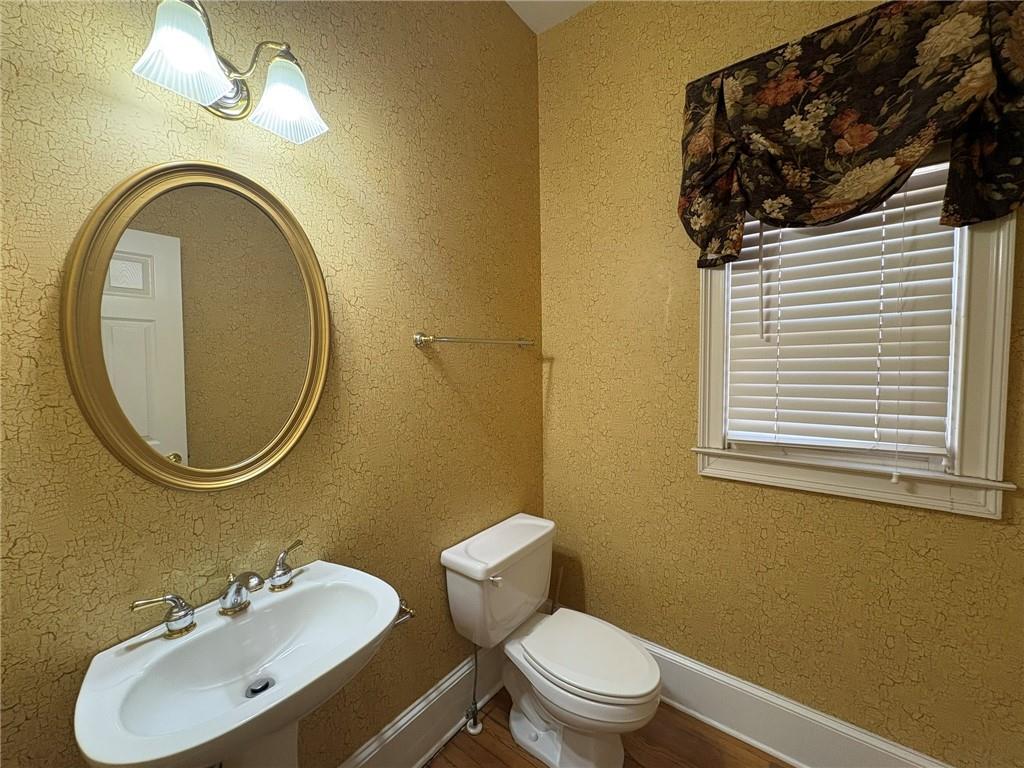 5930 Abbotts Run Trail Duluth, GA 30097 - Photo 8 of 32 a bathroom with a toilet sink and mirror