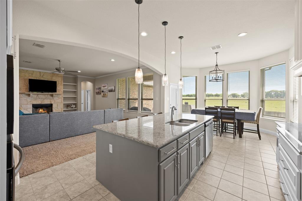 2618 Byrd Ranch Road Midlothian, TX 76065 - Photo 17 of 38 a kitchen with center island table and chairs
