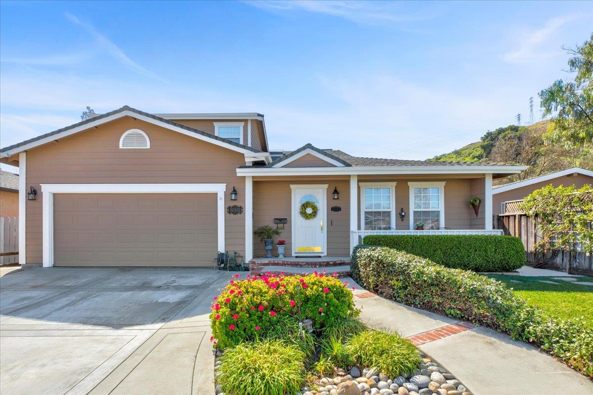 a front view of a house with garden