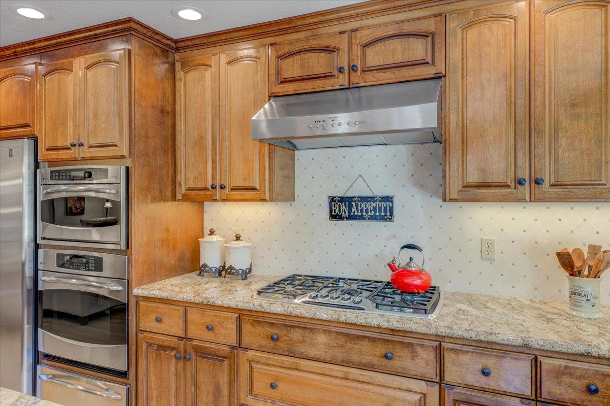 6763 Endmoor Drive San Jose, CA 95119 - Photo 12 of 32 a kitchen with stainless steel appliances granite countertop a refrigerator and a stove