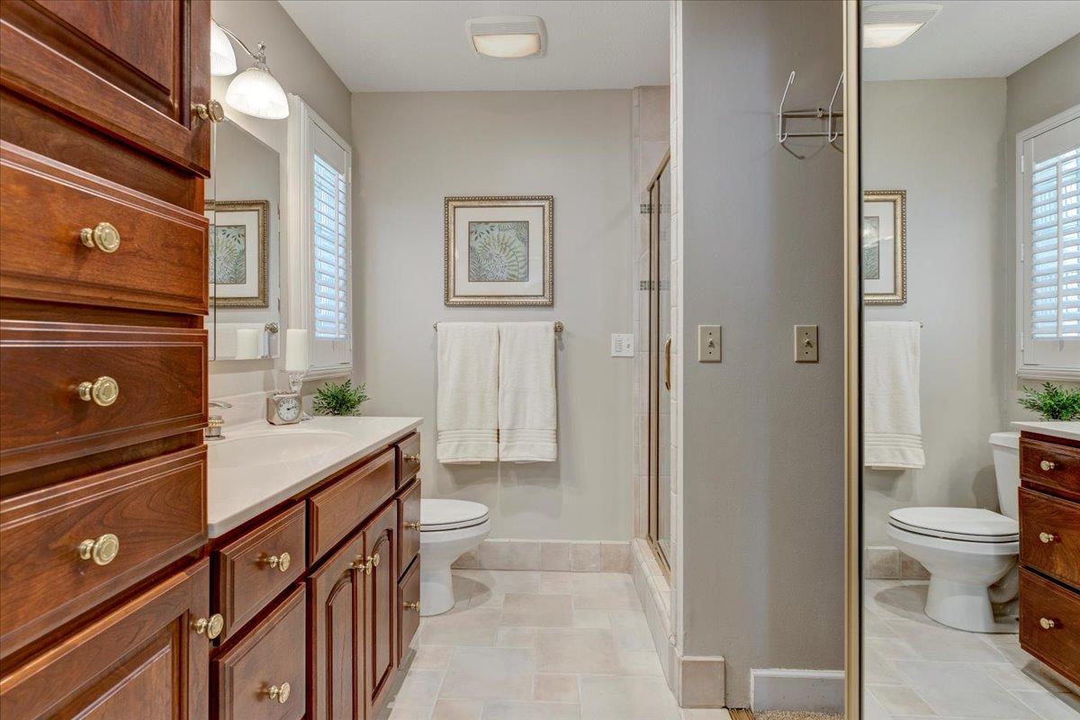 6763 Endmoor Drive San Jose, CA 95119 - Photo 15 of 32 a bathroom with a sink a toilet and a shower