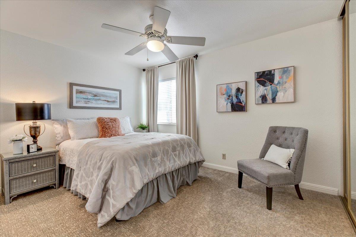 6763 Endmoor Drive San Jose, CA 95119 - Photo 18 of 32 a spacious bedroom with a bed and a chandelier