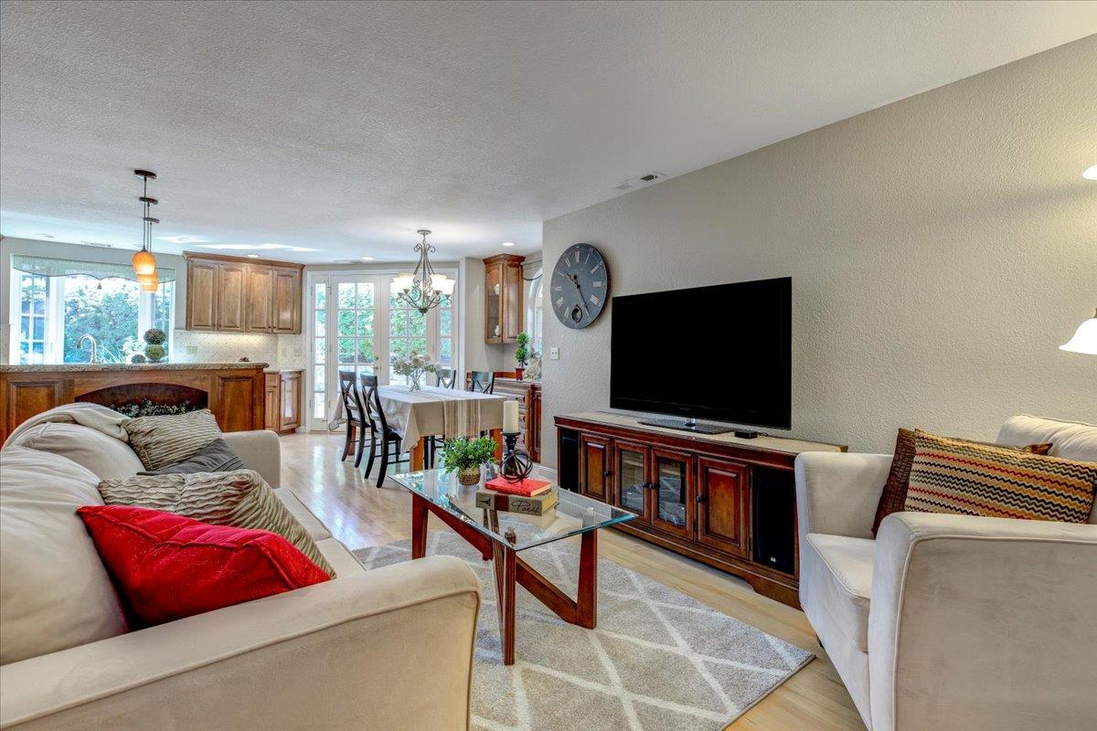 6763 Endmoor Drive San Jose, CA 95119 - Photo 6 of 32 a living room with furniture and a flat screen tv