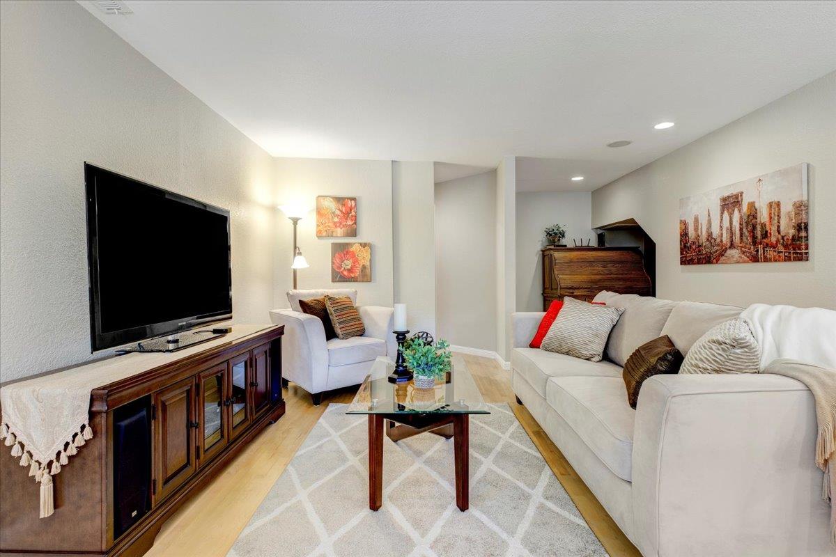 6763 Endmoor Drive San Jose, CA 95119 - Photo 7 of 32 a living room with furniture and a flat screen tv
