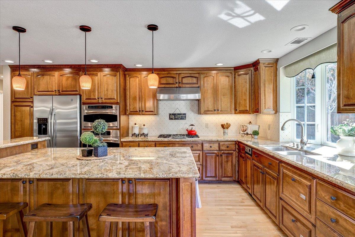 6763 Endmoor Drive San Jose, CA 95119 - Photo 10 of 32 a kitchen with sink cabinets and stove