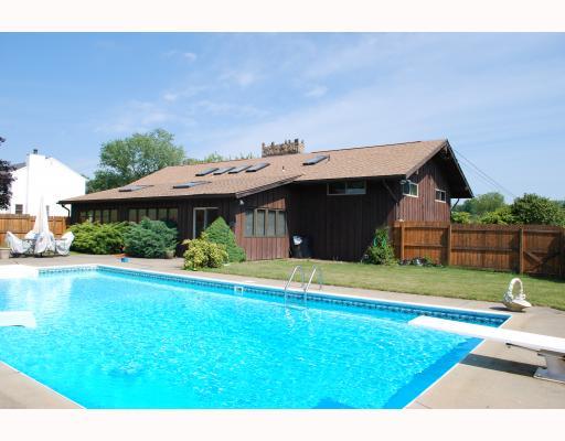 476 Denny Road Valencia, PA 16059 - Photo 15 of 17 Swimming Pool/Hot Tub/Sauna. Inground Swimming Pool with Slide, Fenced in Pool Area entertain right off the sunroom