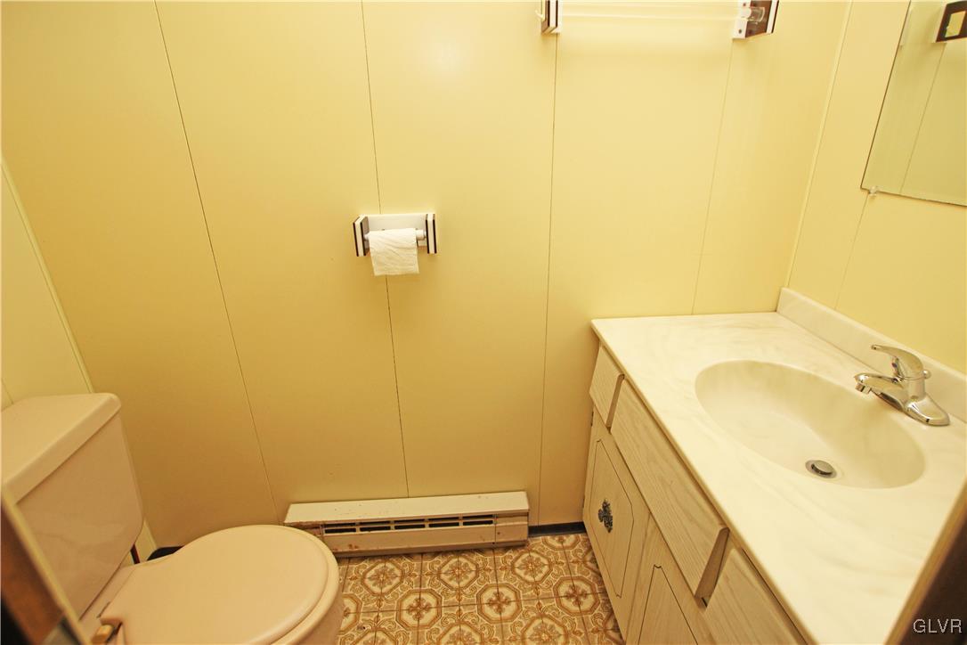 185 Hobby Acres Road Kunkletown, PA 18058 - Photo 23 of 28 a bathroom with a sink a toilet and mirror