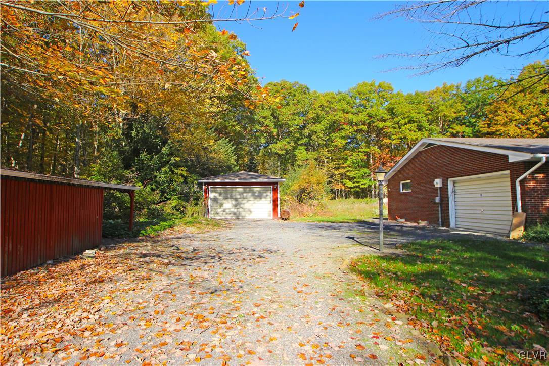 185 Hobby Acres Road Kunkletown, PA 18058 - Photo 4 of 28 a front view of a house with a yard and garage