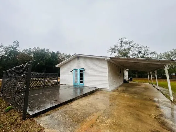 a view of a swimming pool with an outdoor seating and a yard
