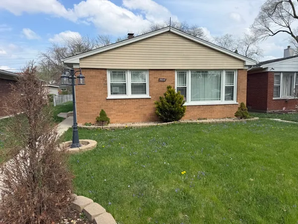 a front view of a house with a yard and porch