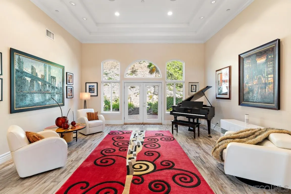 246 Yucca Road Fallbrook, CA 92028 - Photo 13 of 68 a living room with furniture and a floor to ceiling window
