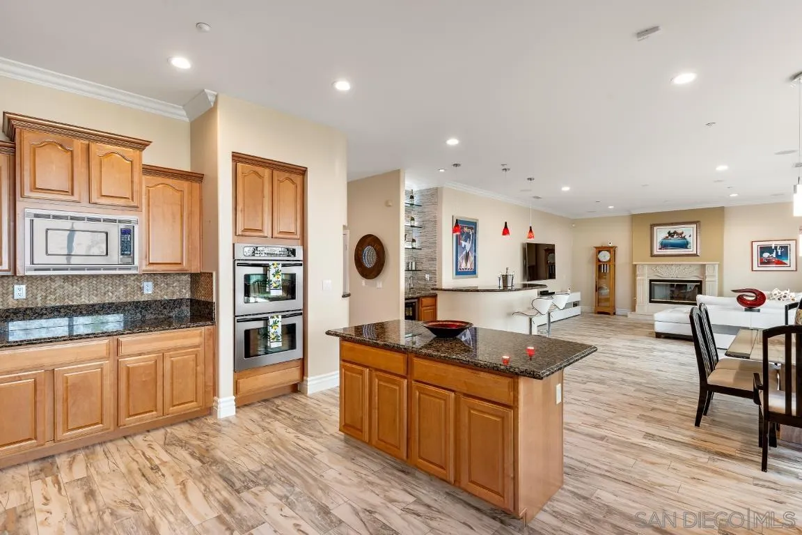 246 Yucca Road Fallbrook, CA 92028 - Photo 18 of 68 a kitchen with stainless steel appliances granite countertop a stove and a sink
