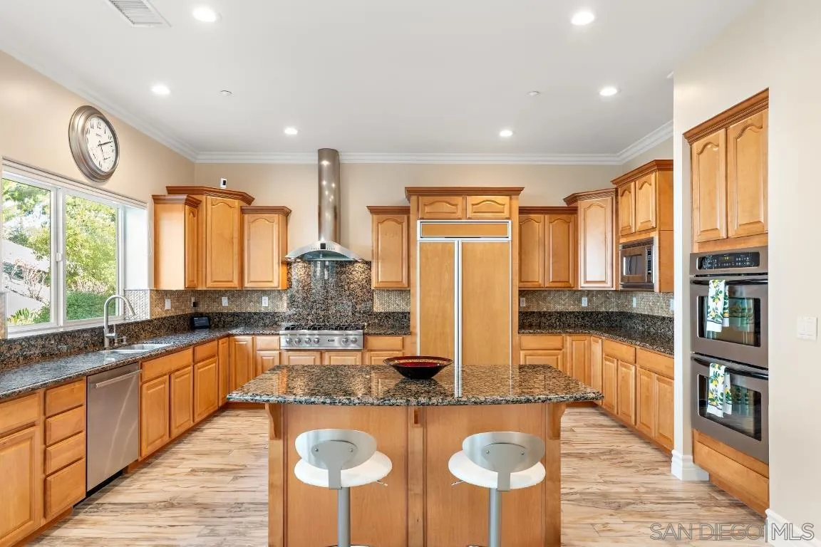 246 Yucca Road Fallbrook, CA 92028 - Photo 20 of 68 a kitchen with stainless steel appliances granite countertop a stove and cabinets