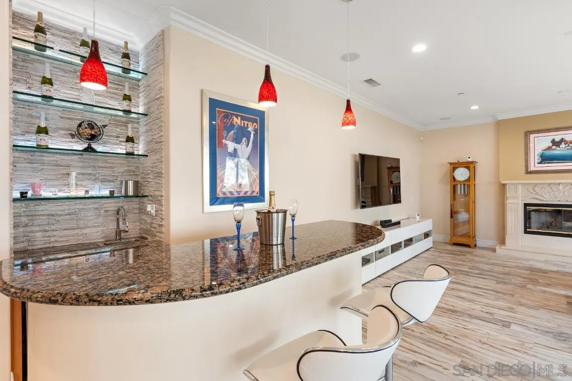 246 Yucca Road Fallbrook, CA 92028 - Photo 23 of 68 a dining hall with granite countertop a sink and a wooden floor
