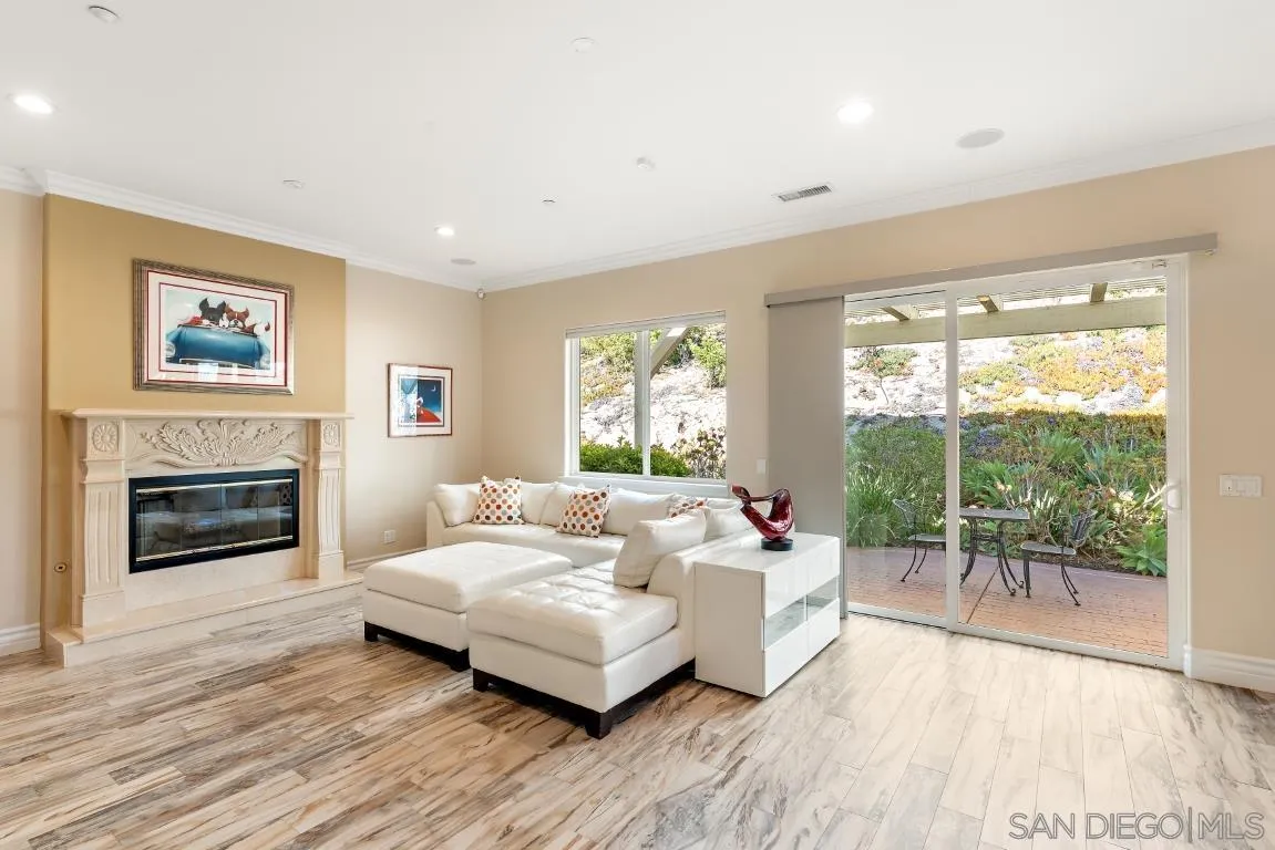 246 Yucca Road Fallbrook, CA 92028 - Photo 26 of 68 a living room with furniture and a fireplace