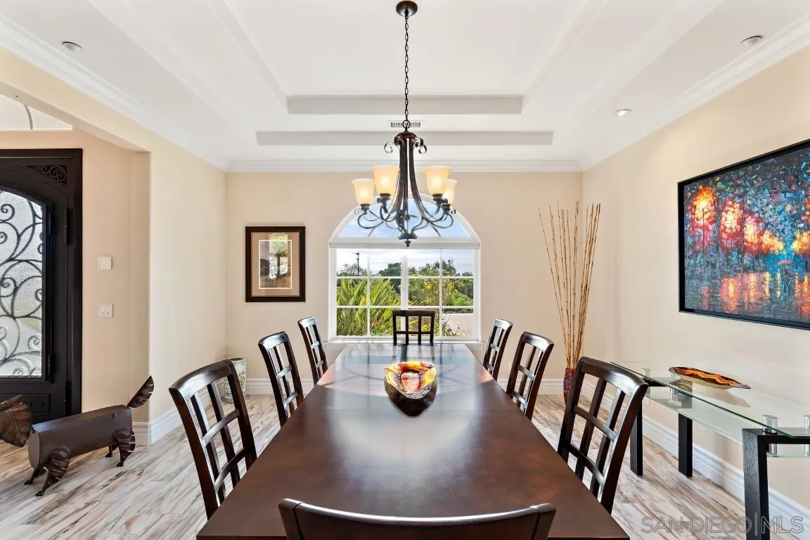 246 Yucca Road Fallbrook, CA 92028 - Photo 29 of 68 a view of a dining room with furniture window and wooden floor