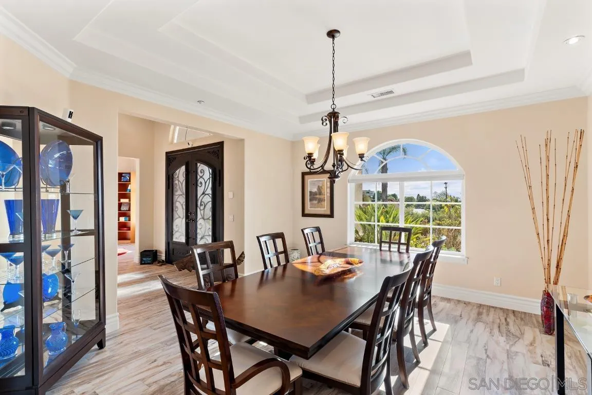 246 Yucca Road Fallbrook, CA 92028 - Photo 30 of 68 a view of a dining room with furniture window and wooden floor
