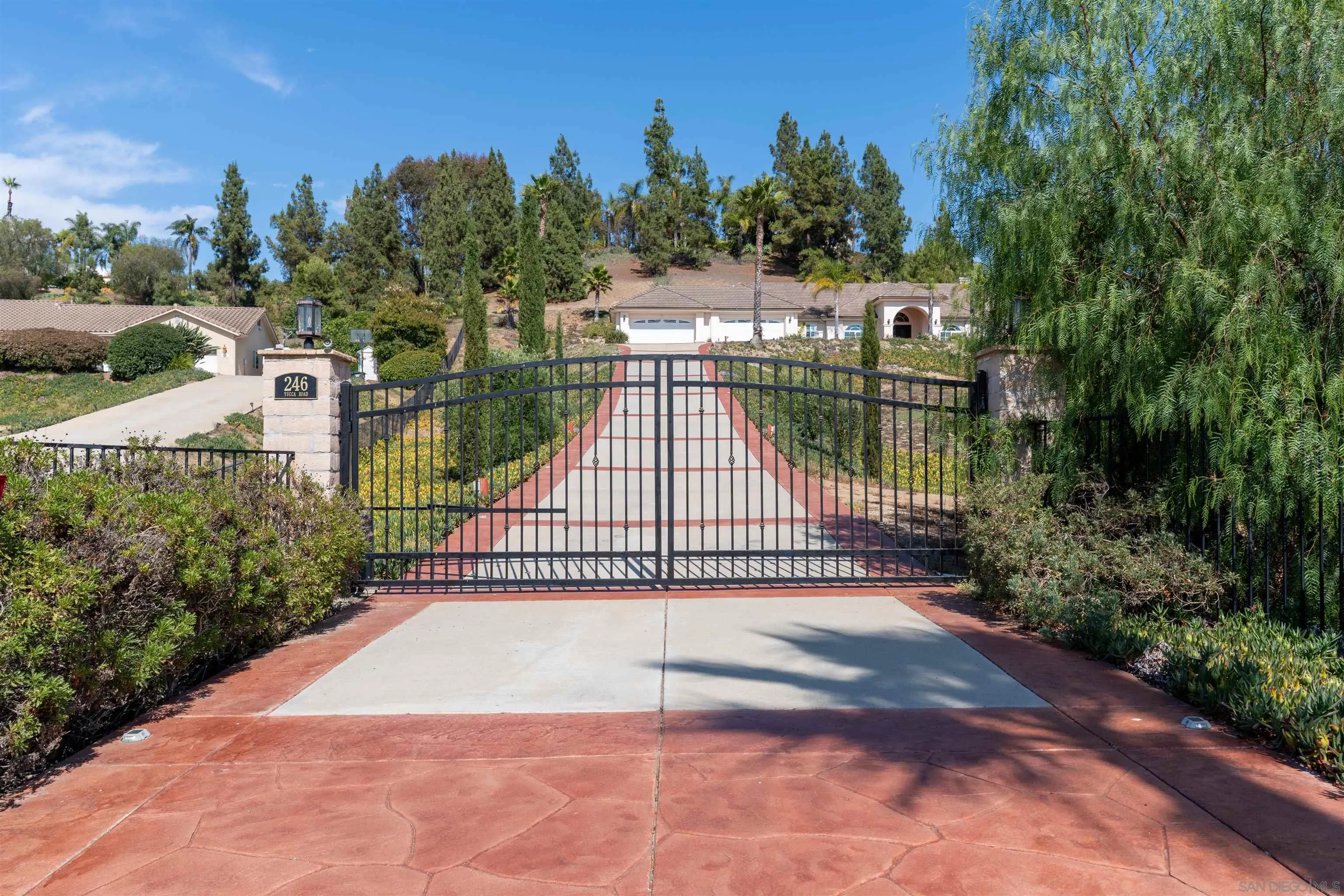 246 Yucca Road Fallbrook, CA 92028 - Photo 3 of 68 a view of a backyard with a garden