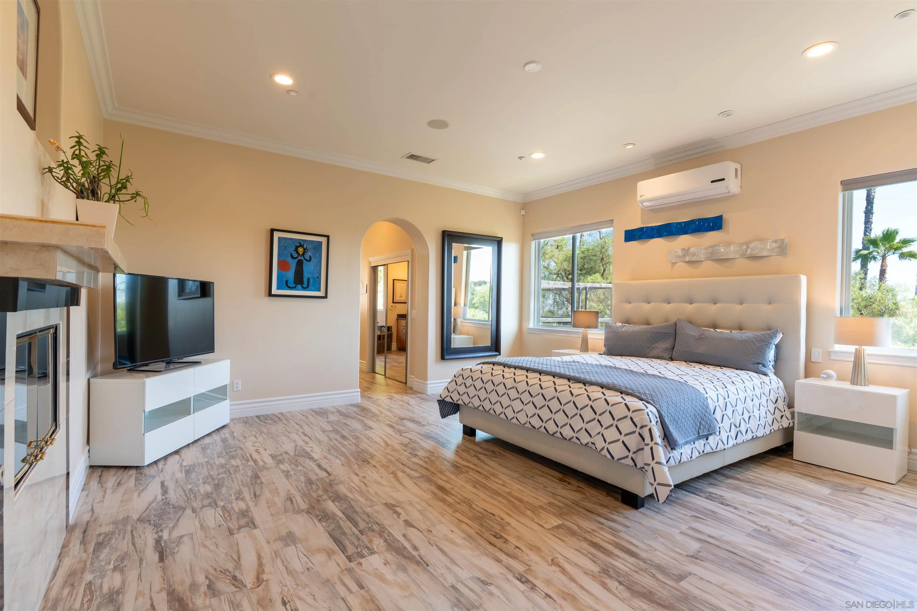 246 Yucca Road Fallbrook, CA 92028 - Photo 39 of 68 a bedroom with a bed and a flat screen tv
