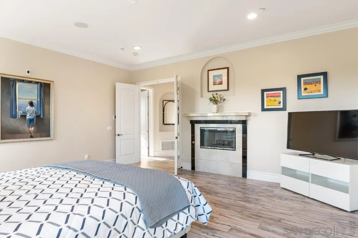 246 Yucca Road Fallbrook, CA 92028 - Photo 41 of 68 a bedroom with a bed and a flat screen tv