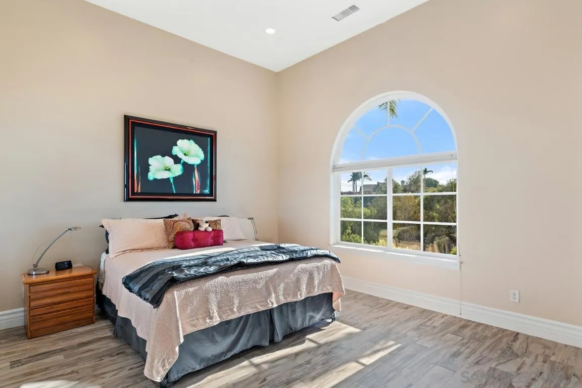246 Yucca Road Fallbrook, CA 92028 - Photo 44 of 68 a bedroom with a bed and a window