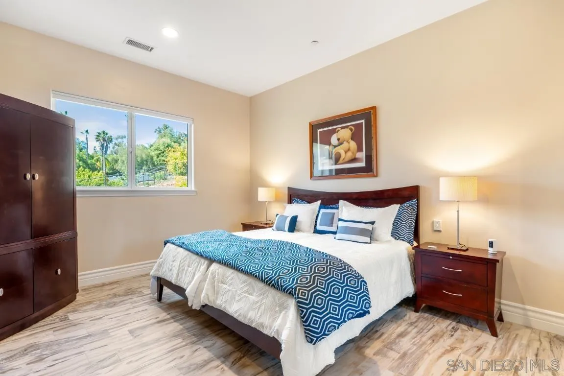 246 Yucca Road Fallbrook, CA 92028 - Photo 45 of 68 a bedroom with a bed and a window