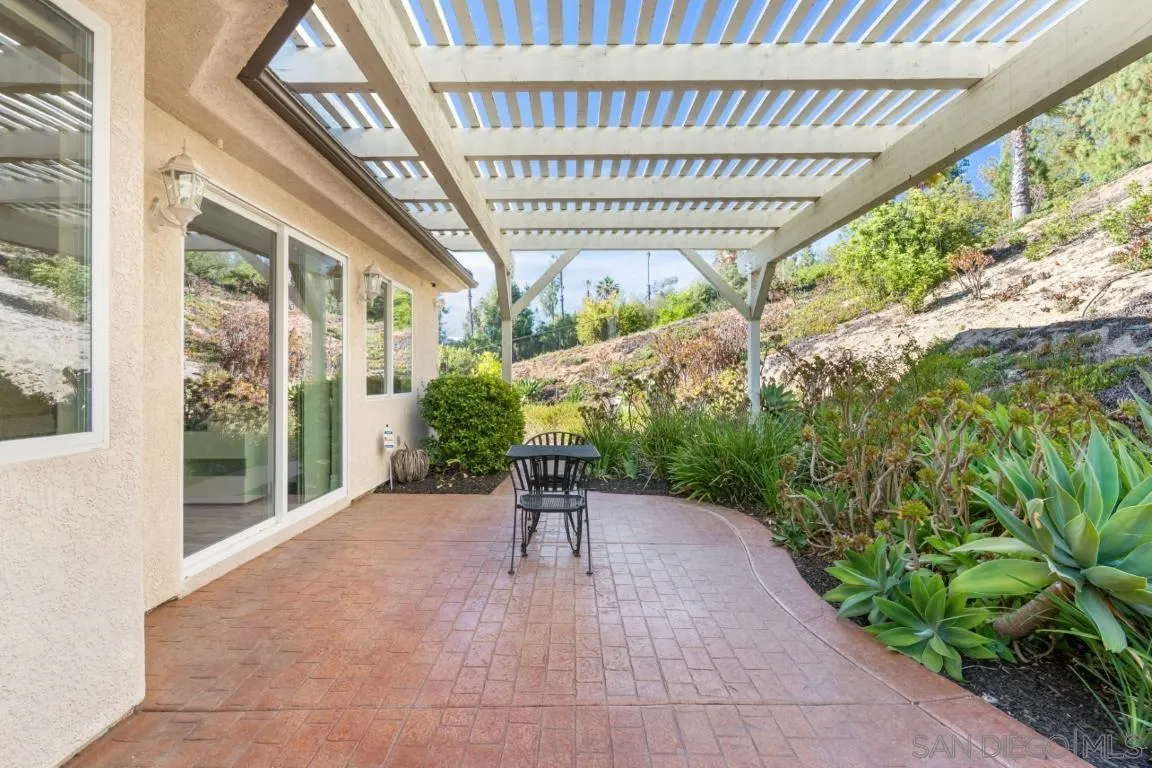 246 Yucca Road Fallbrook, CA 92028 - Photo 56 of 68 a porch with a table and chairs
