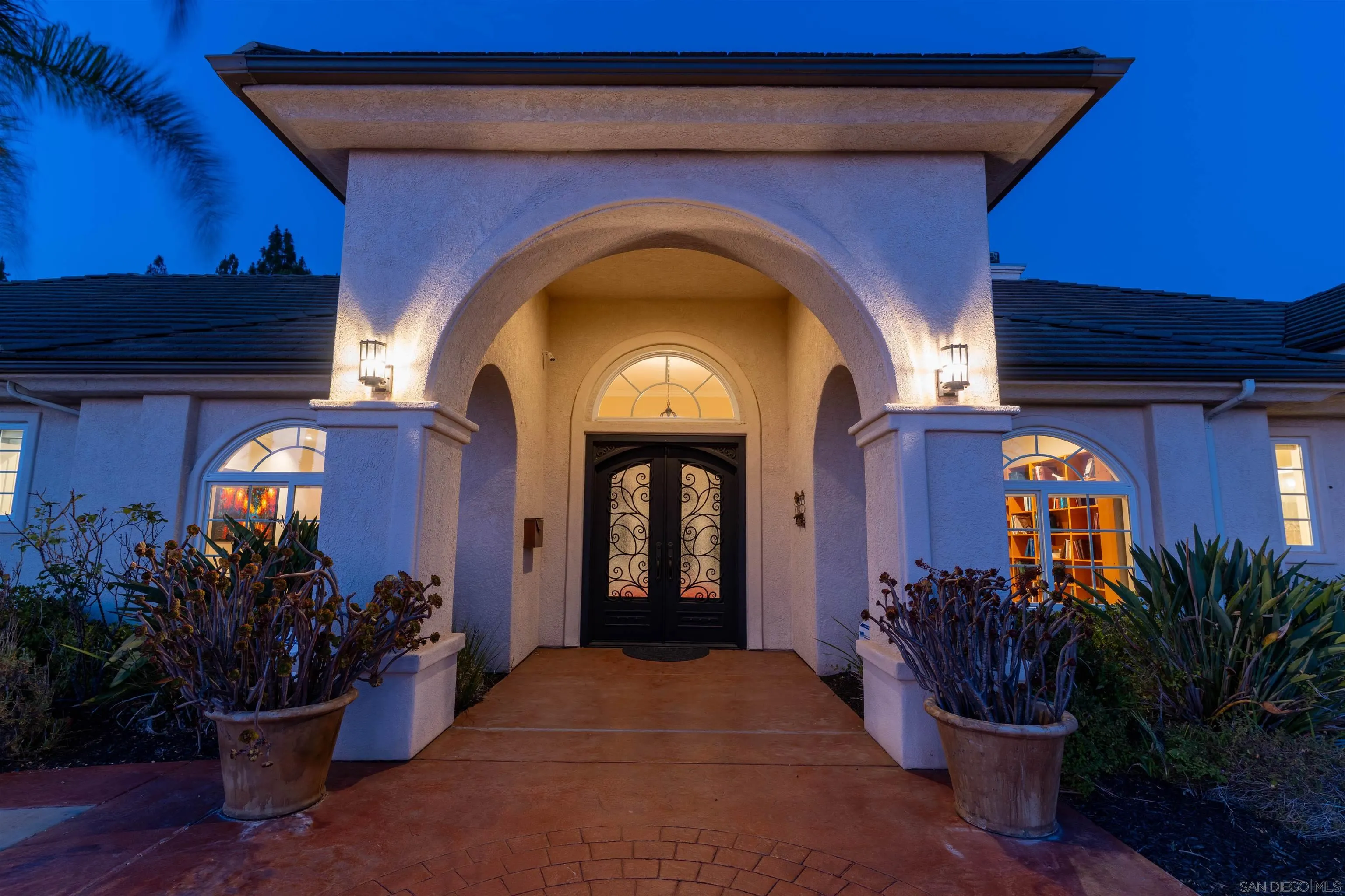 246 Yucca Road Fallbrook, CA 92028 - Photo 6 of 68 a view of a wooden door with potted plants in front of door