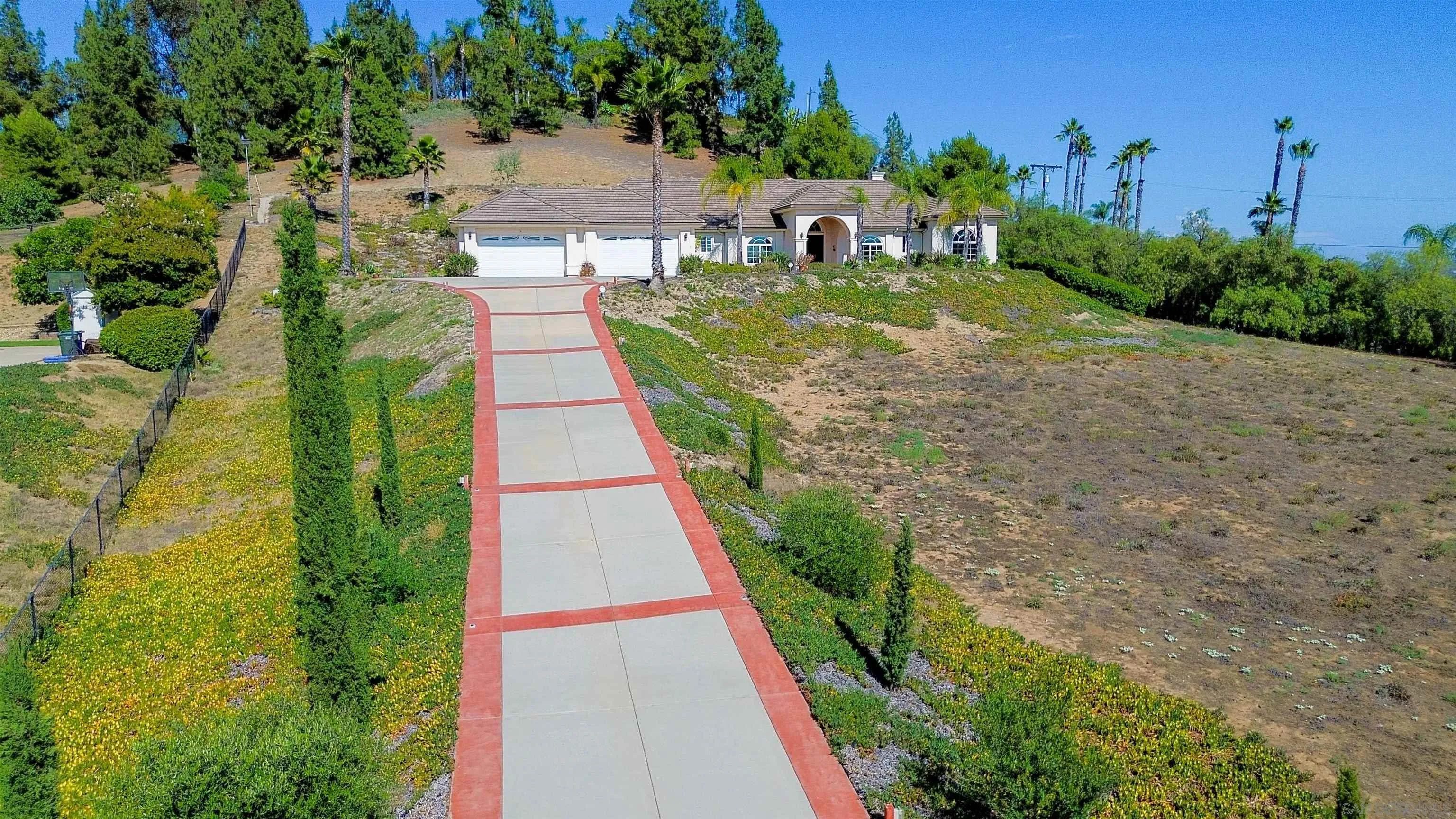 246 Yucca Road Fallbrook, CA 92028 - Photo 66 of 68 a view of house with garden