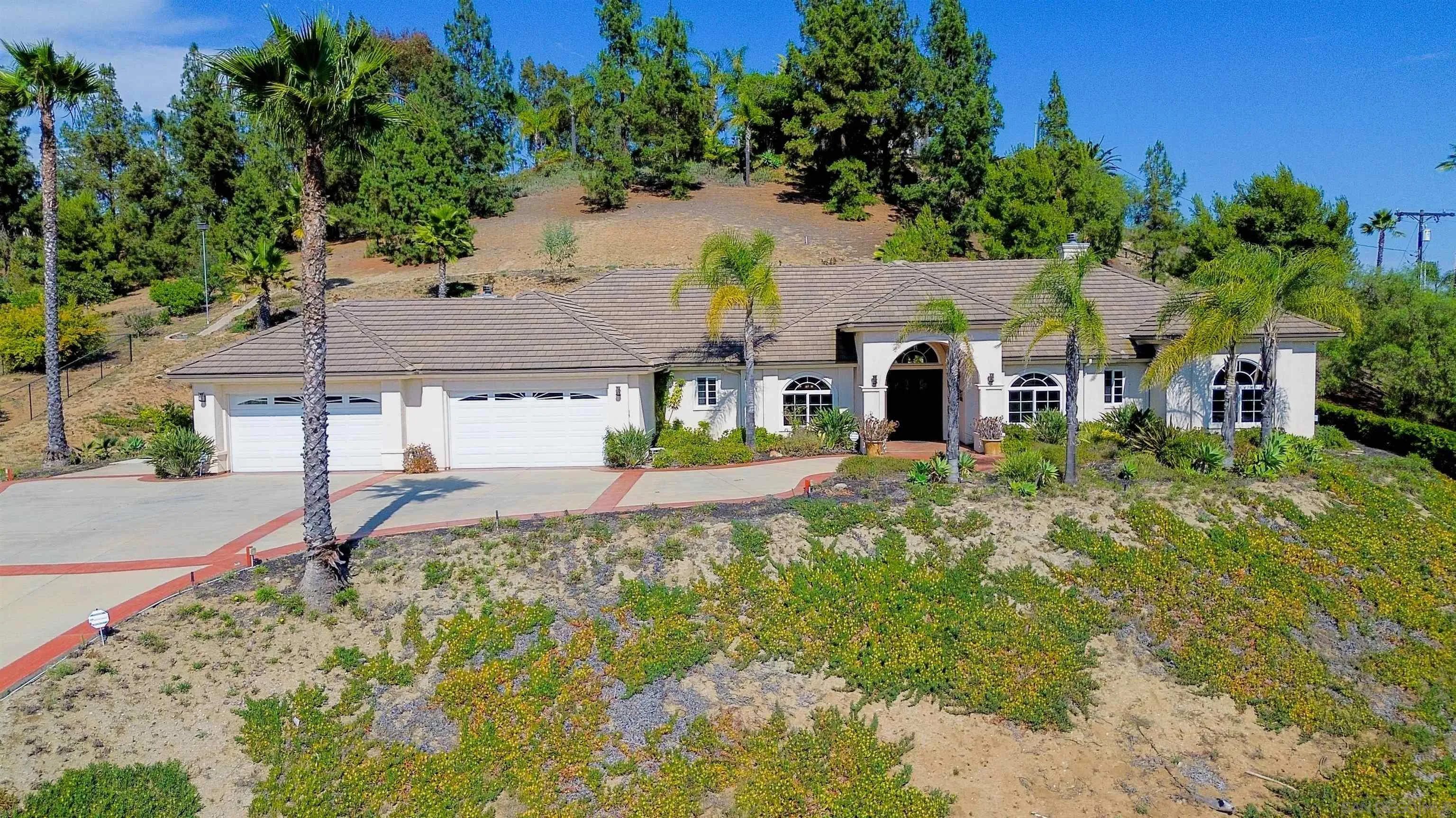 246 Yucca Road Fallbrook, CA 92028 - Photo 67 of 68 a front view of a house with a yard